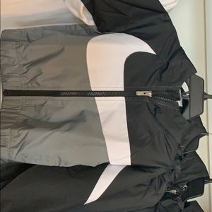 Nike swoosh, wind breaker.
